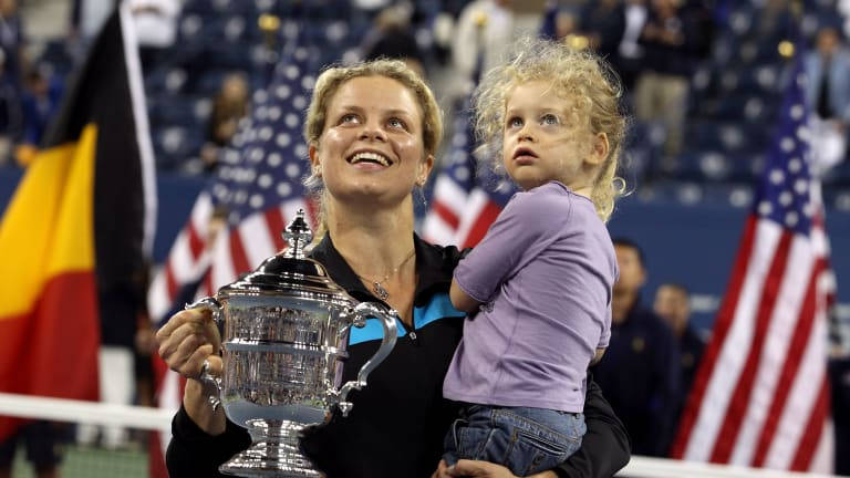 Kim Clijsters celebrating with her sports trophy Wallpaper