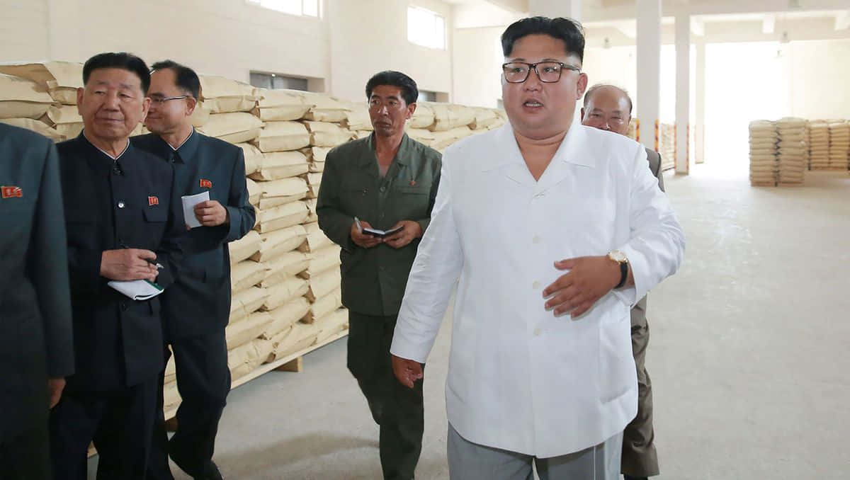 Kim Jong Il Is Seen Walking Around A Factory
