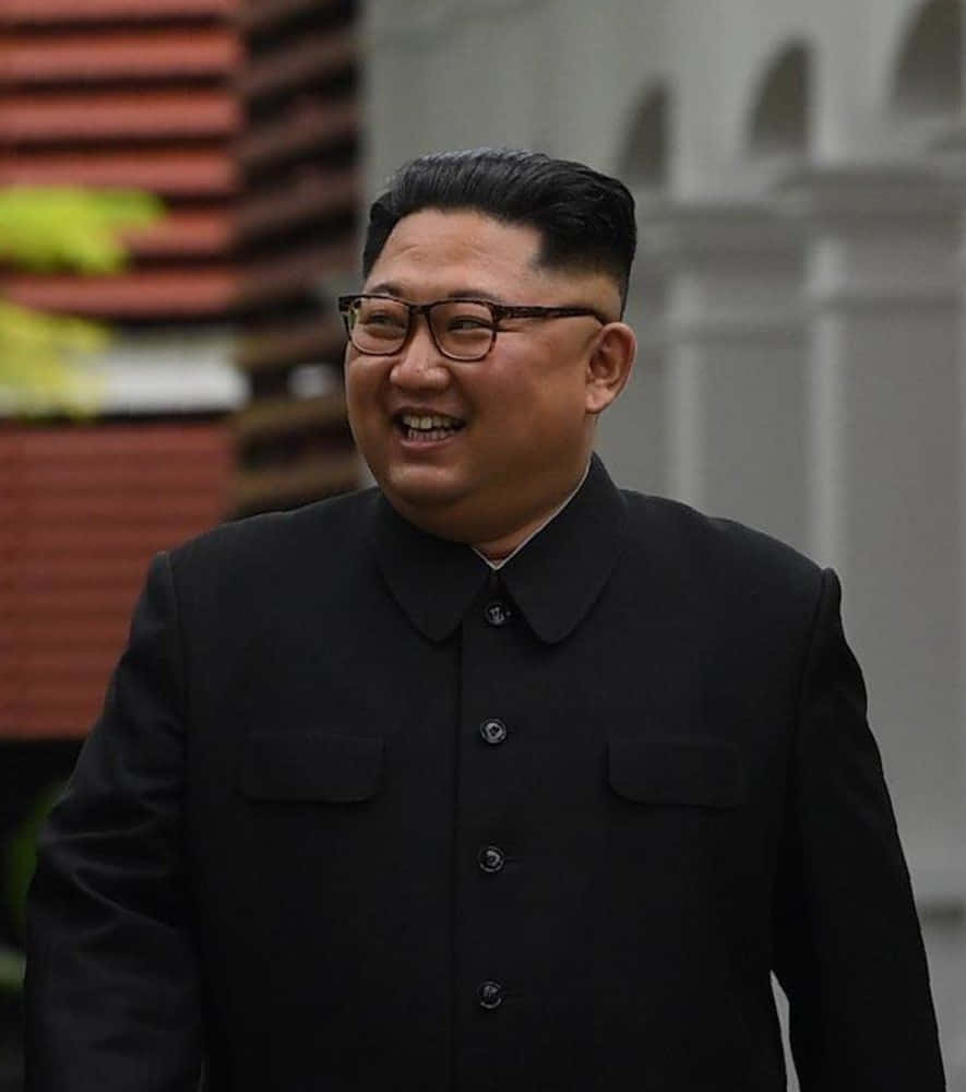 Kim Jong - Un Smiles While Walking Down The Street
