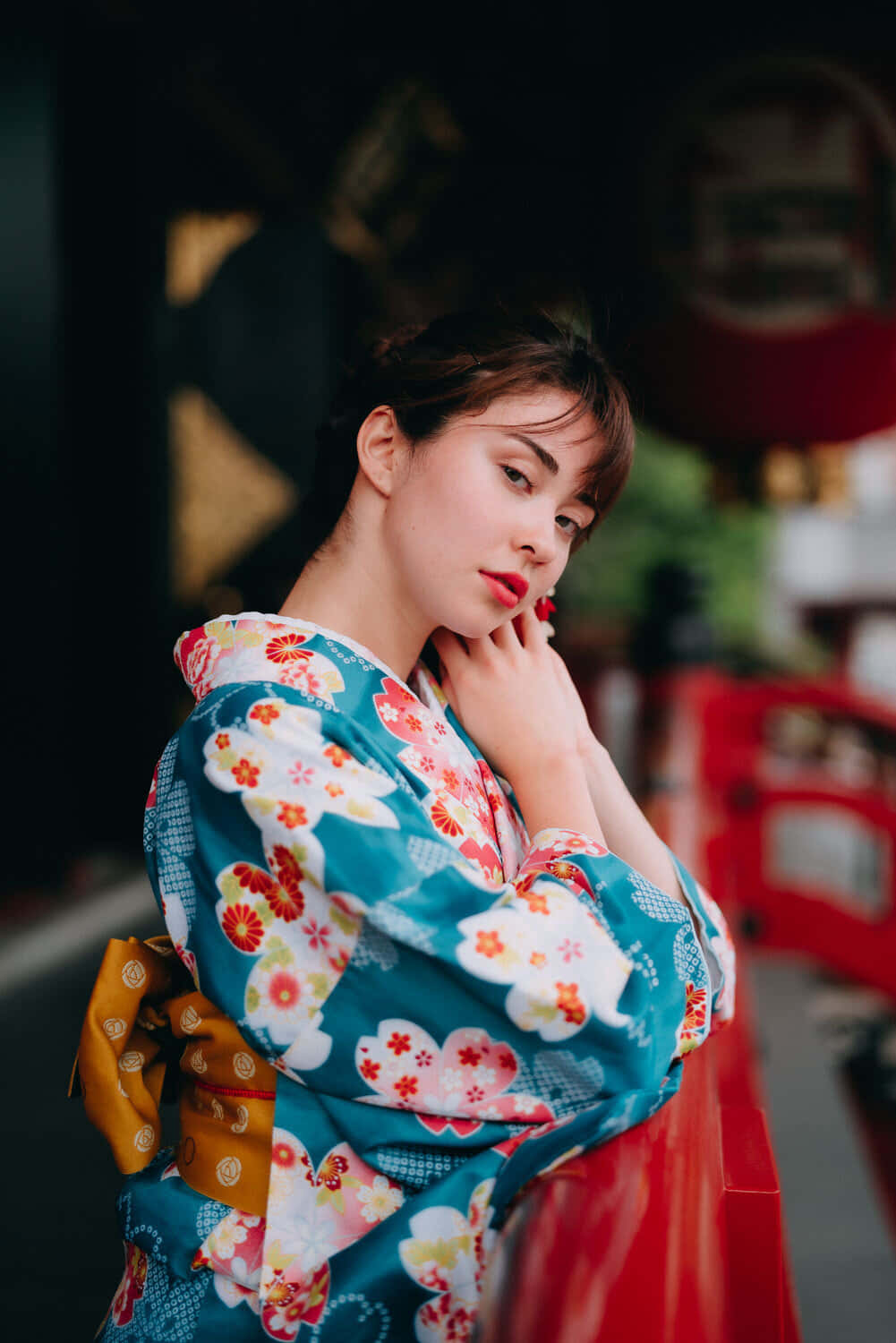 A beautiful kimono patterned in shades of red, yellow, and blue.
