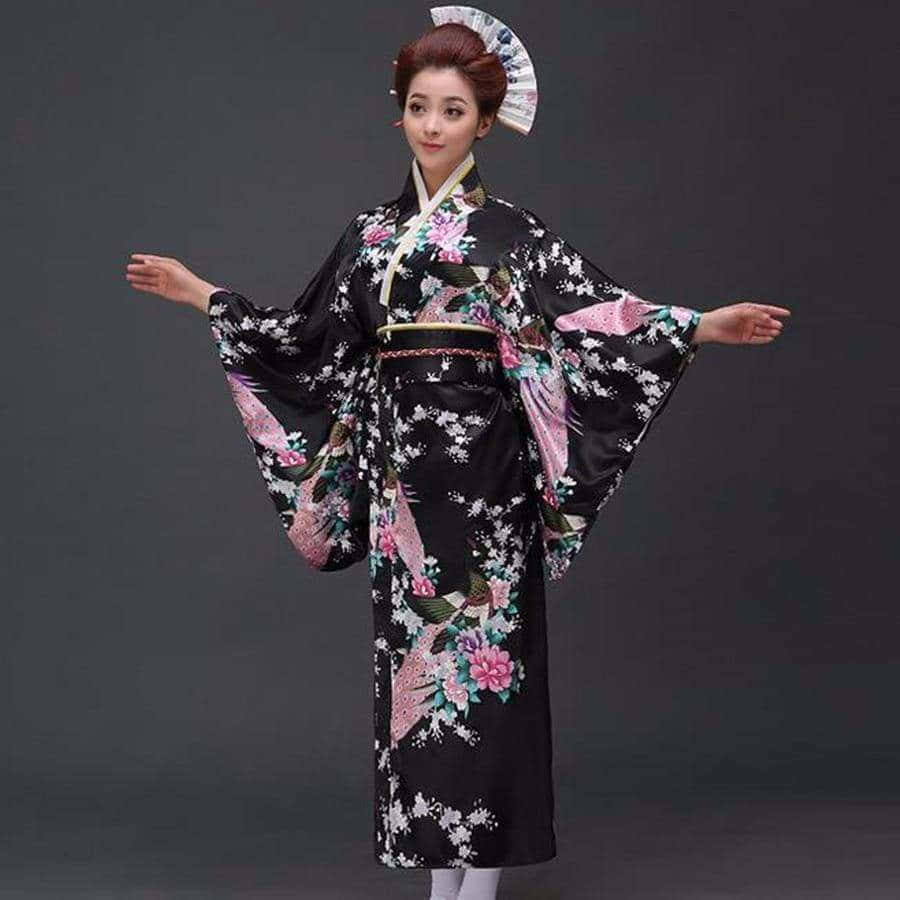 A Woman In A Kimono Is Standing With Her Arms Out