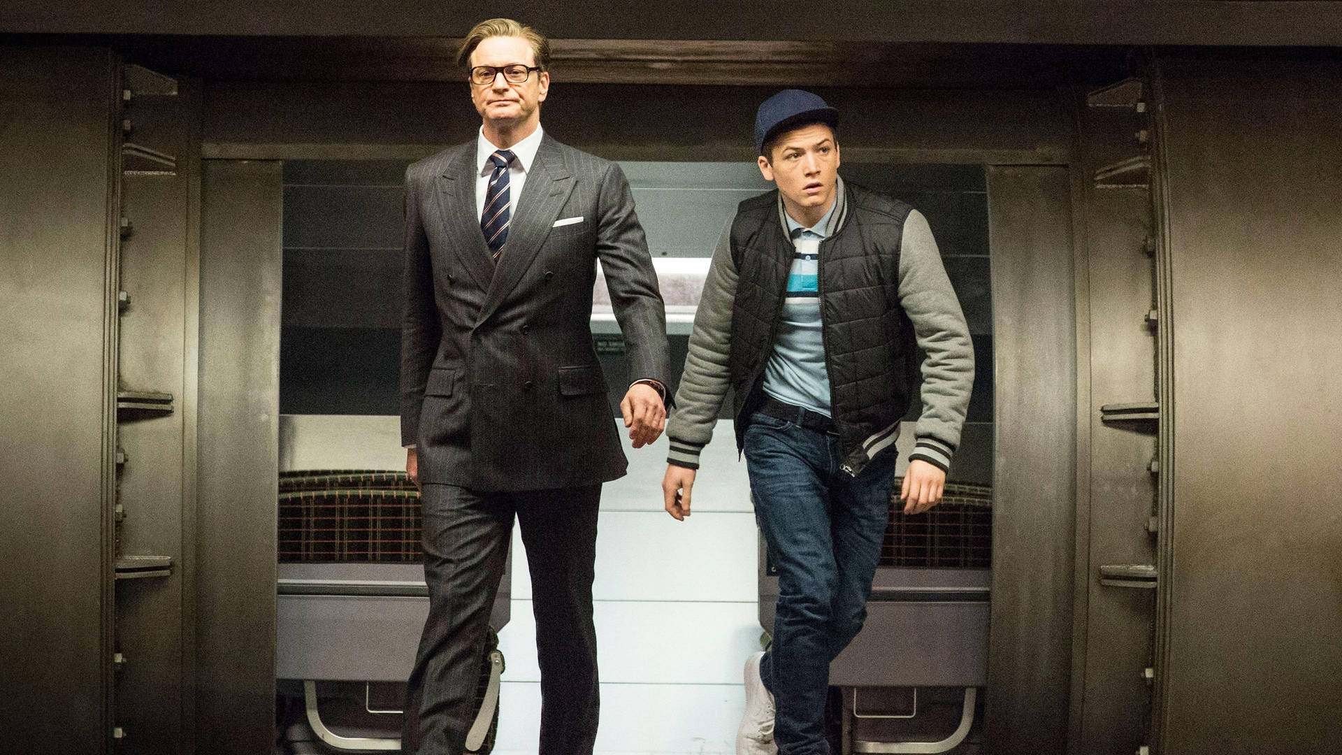 A Riveting Scene from Kingsman: Eggsy and Galahad in Action Wallpaper