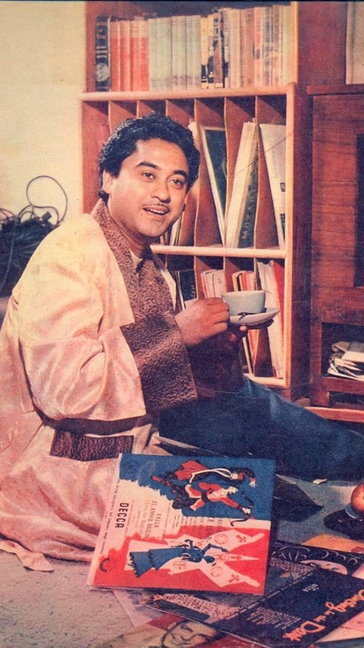 Kishore Kumar Surrounded By Records Wallpaper