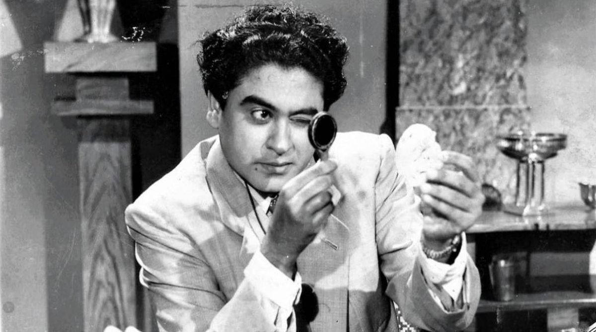 Kishore Kumar With A Magnifying Glass Wallpaper