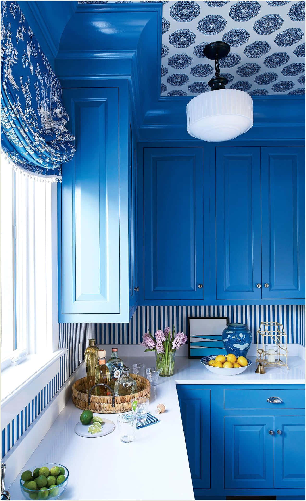 A Blue Kitchen With A Blue Wallpaper