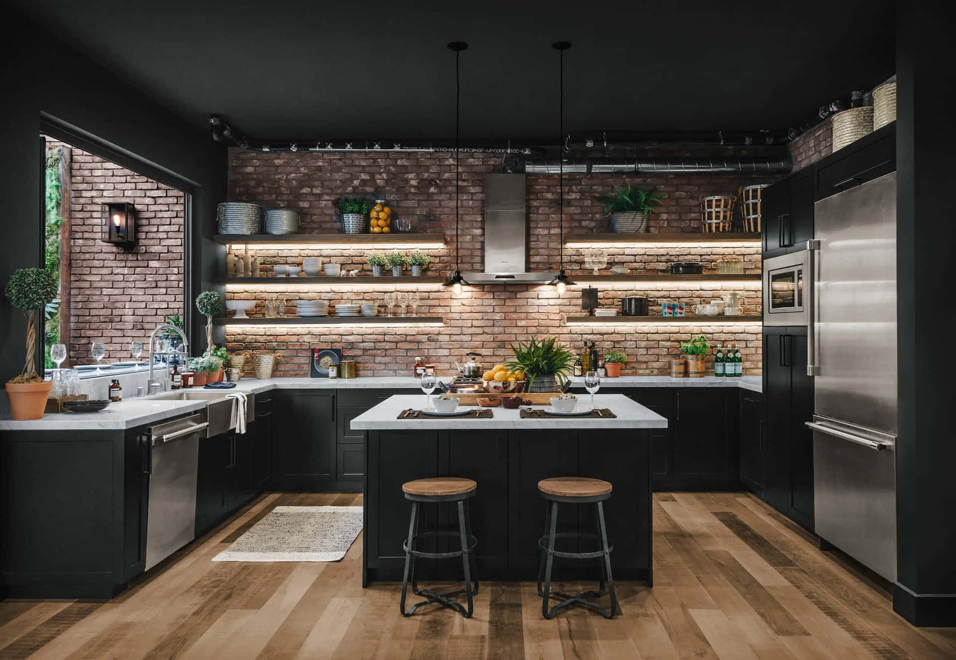 A Kitchen With Black Walls And Wooden Floors