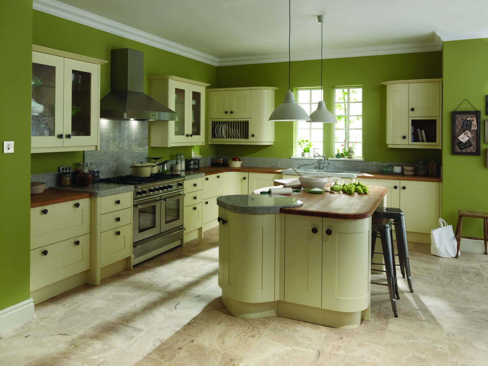 A Kitchen With Green Walls And White Counter Tops