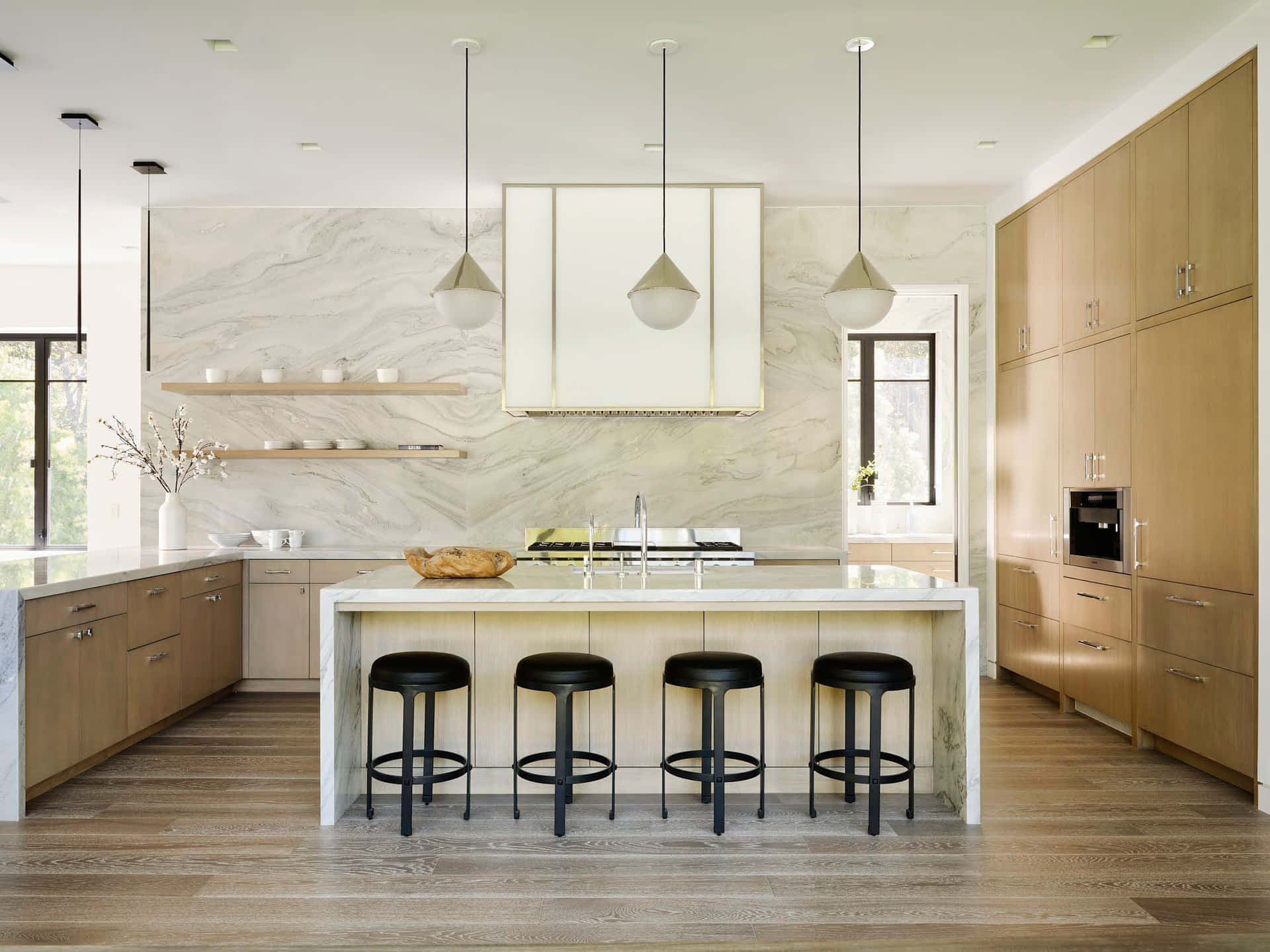 A Modern Kitchen With Wooden Floors And Stools
