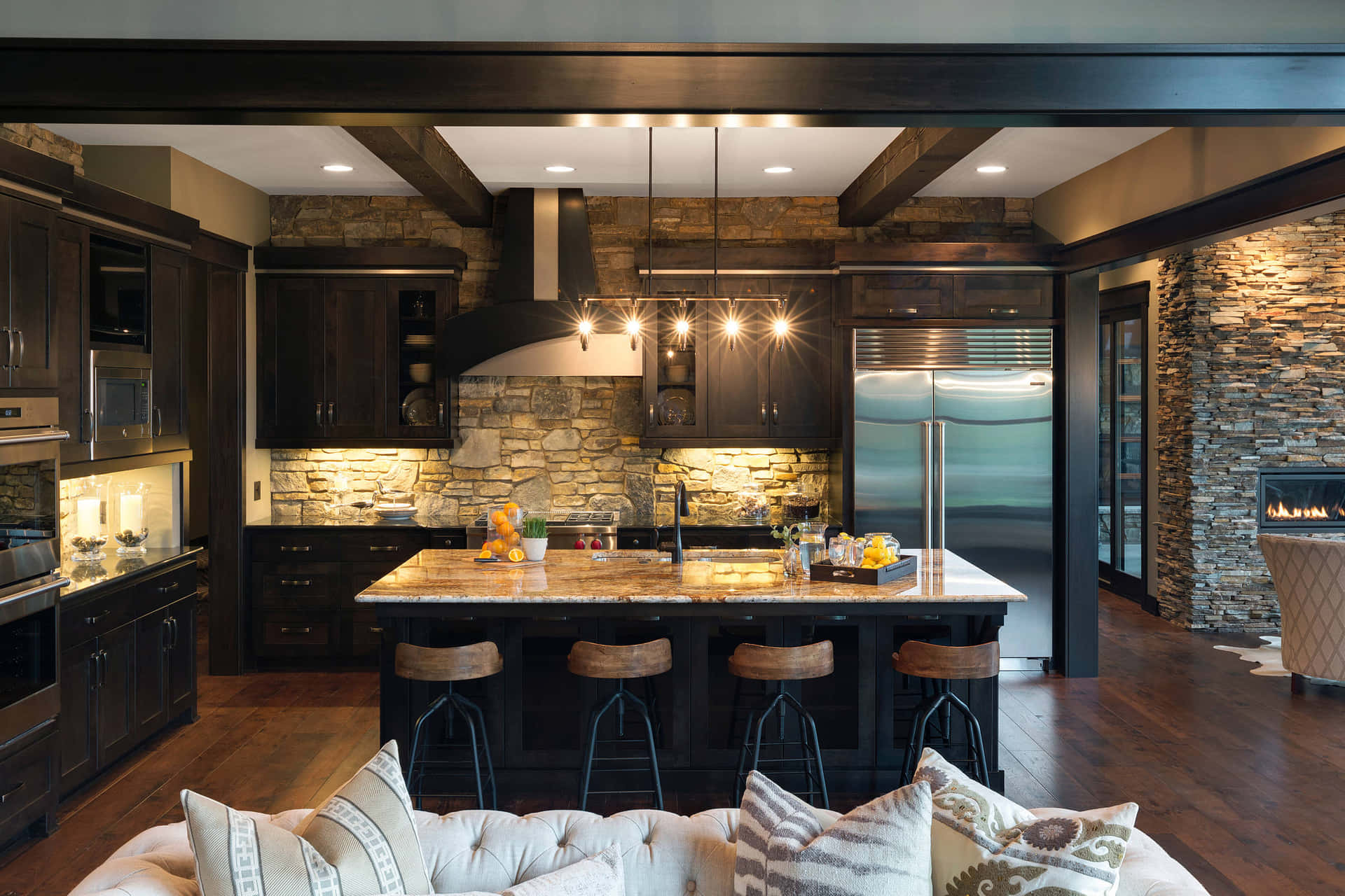 A Kitchen With A Fireplace And A Large Island