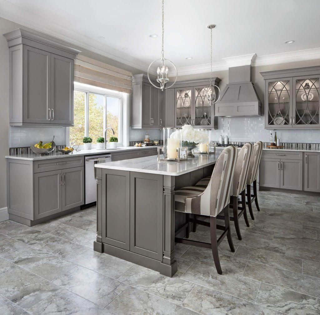 A Kitchen With Gray Cabinets And A Center Island