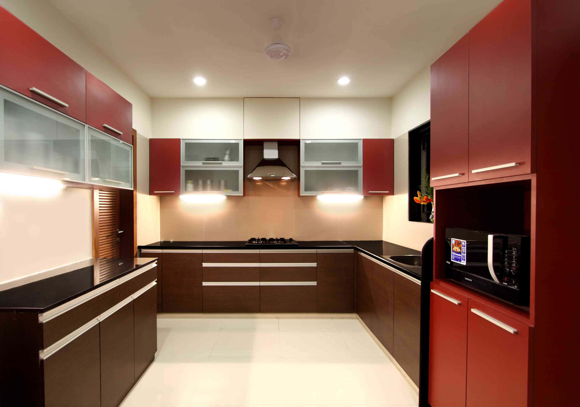 A Kitchen With Red And White Cabinets
