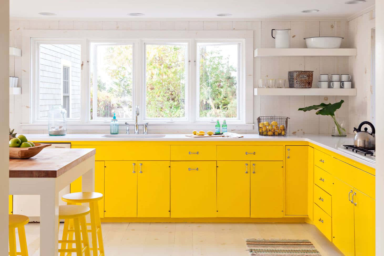A Kitchen With Yellow Cabinets