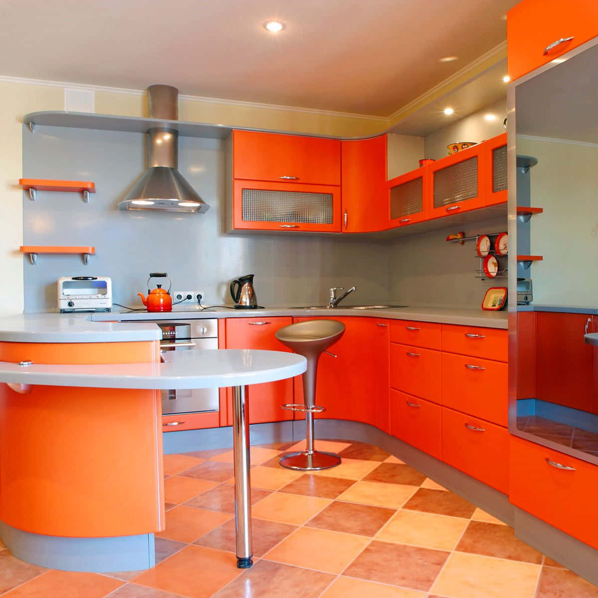 A Kitchen With Orange Cabinets And A Bar