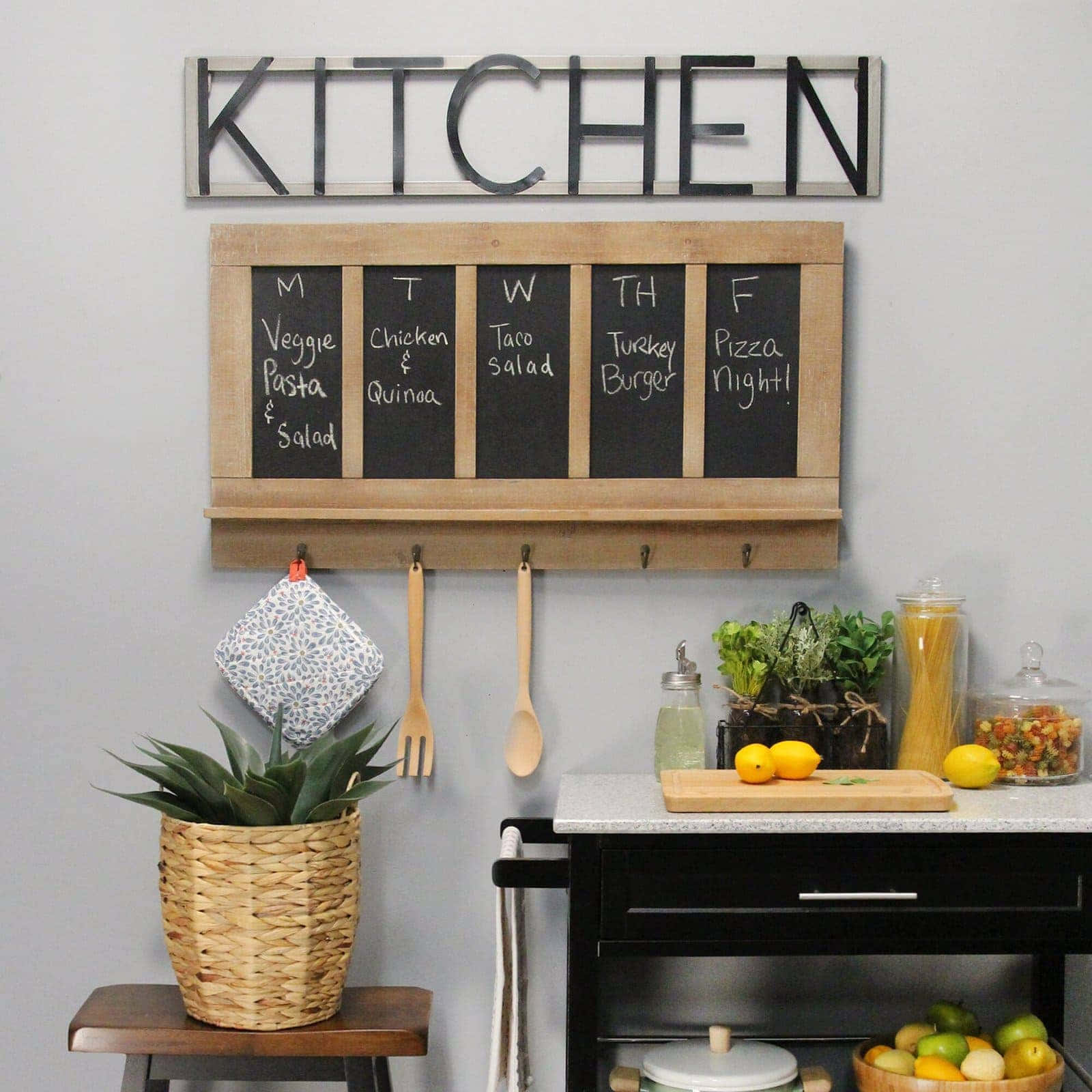 A Kitchen With A Chalkboard And A Wooden Stool
