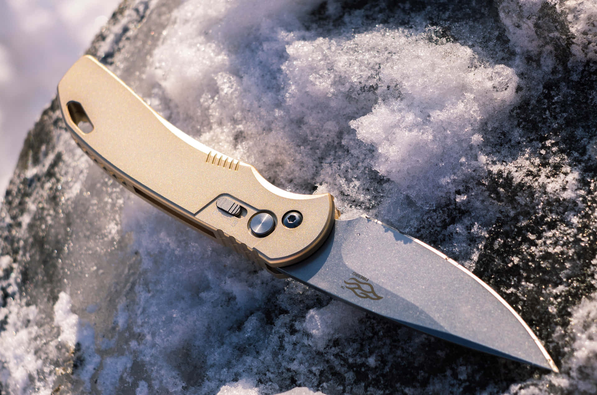 A Knife Is Sitting On Top Of A Rock In The Snow
