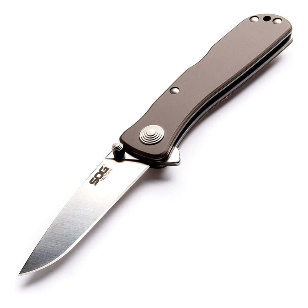 A Knife With A Black Handle On A White Surface