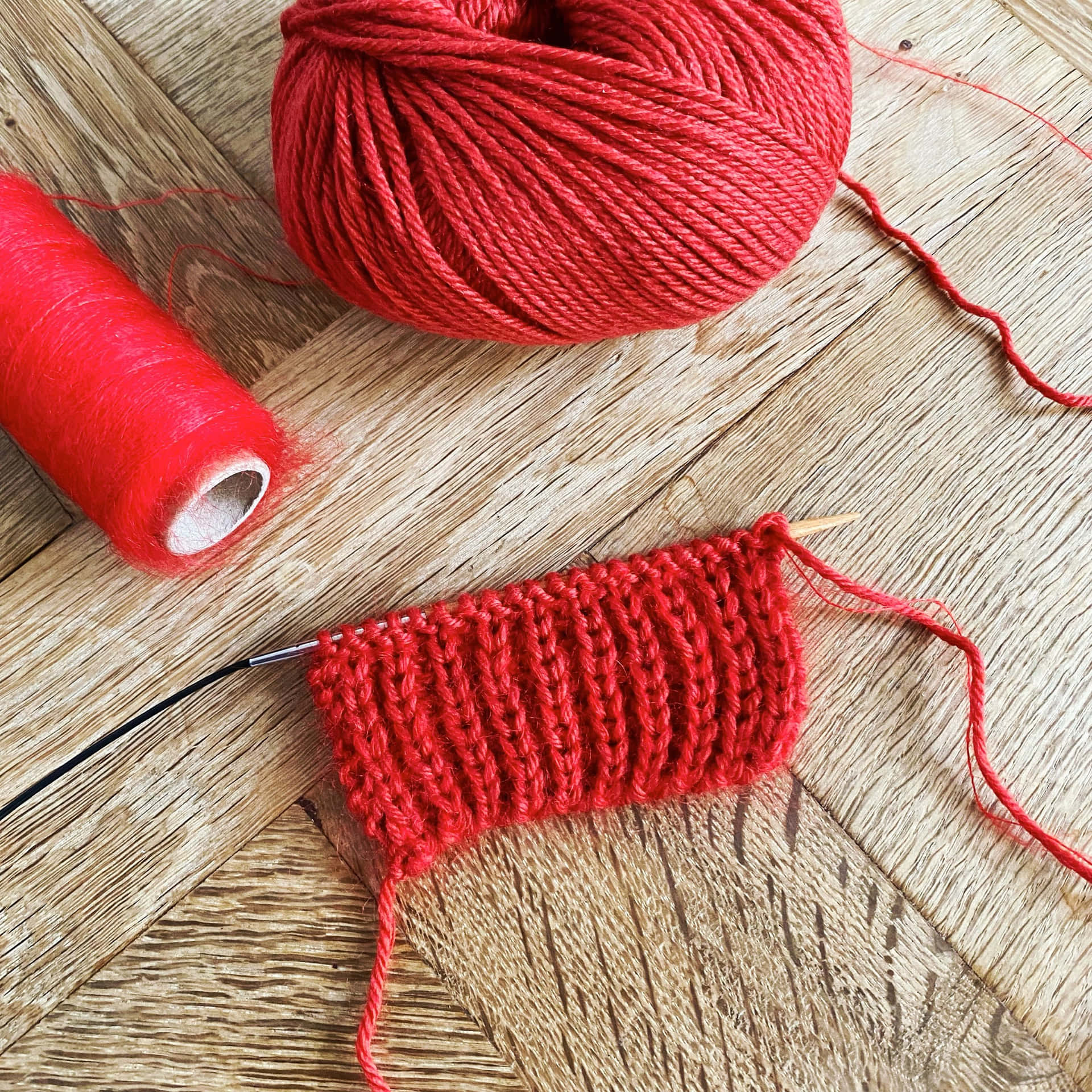 Knitting A Red Cotton Yarn Wallpaper