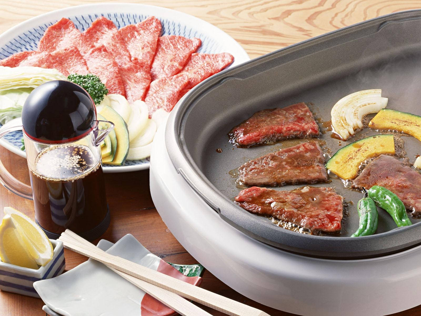 Rebanadasde Carne De Kobe En Una Parrilla Eléctrica Fondo de pantalla