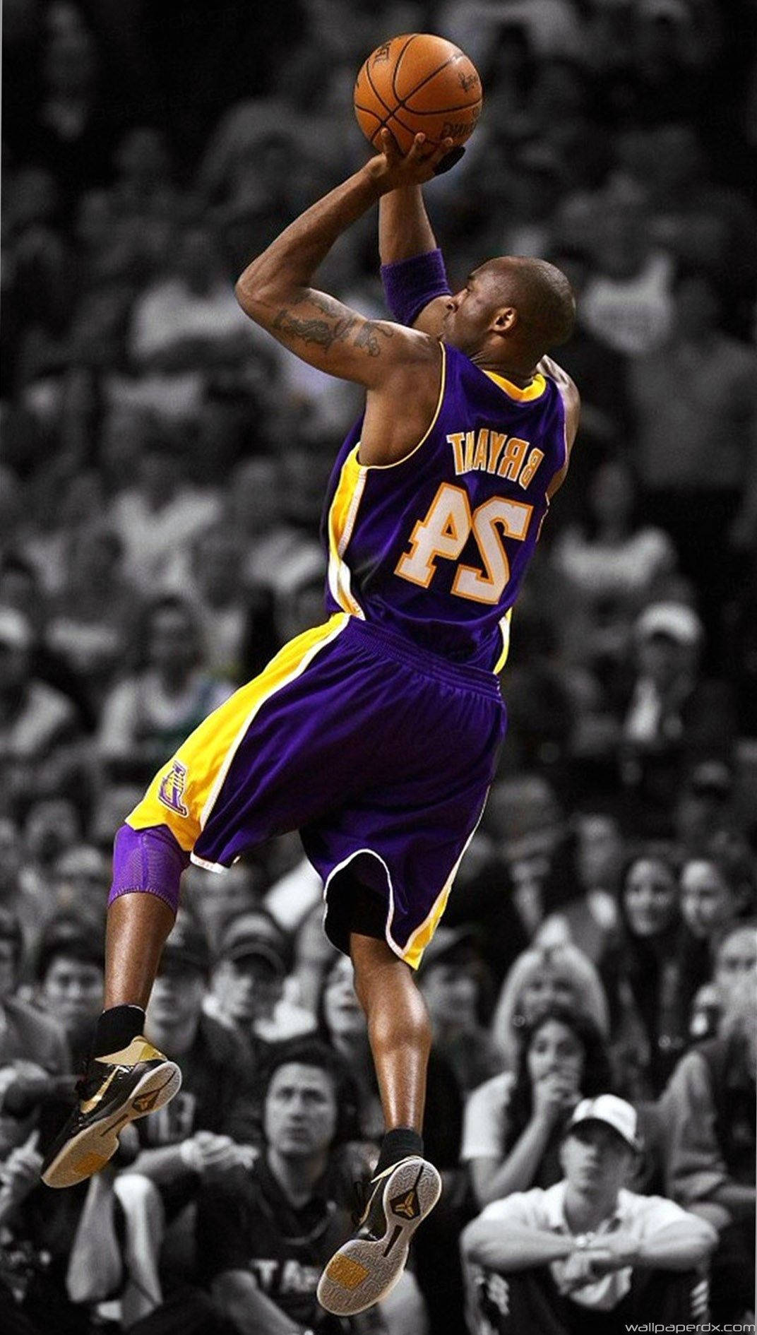 Kobe Bryant stands with an iPhone Wallpaper