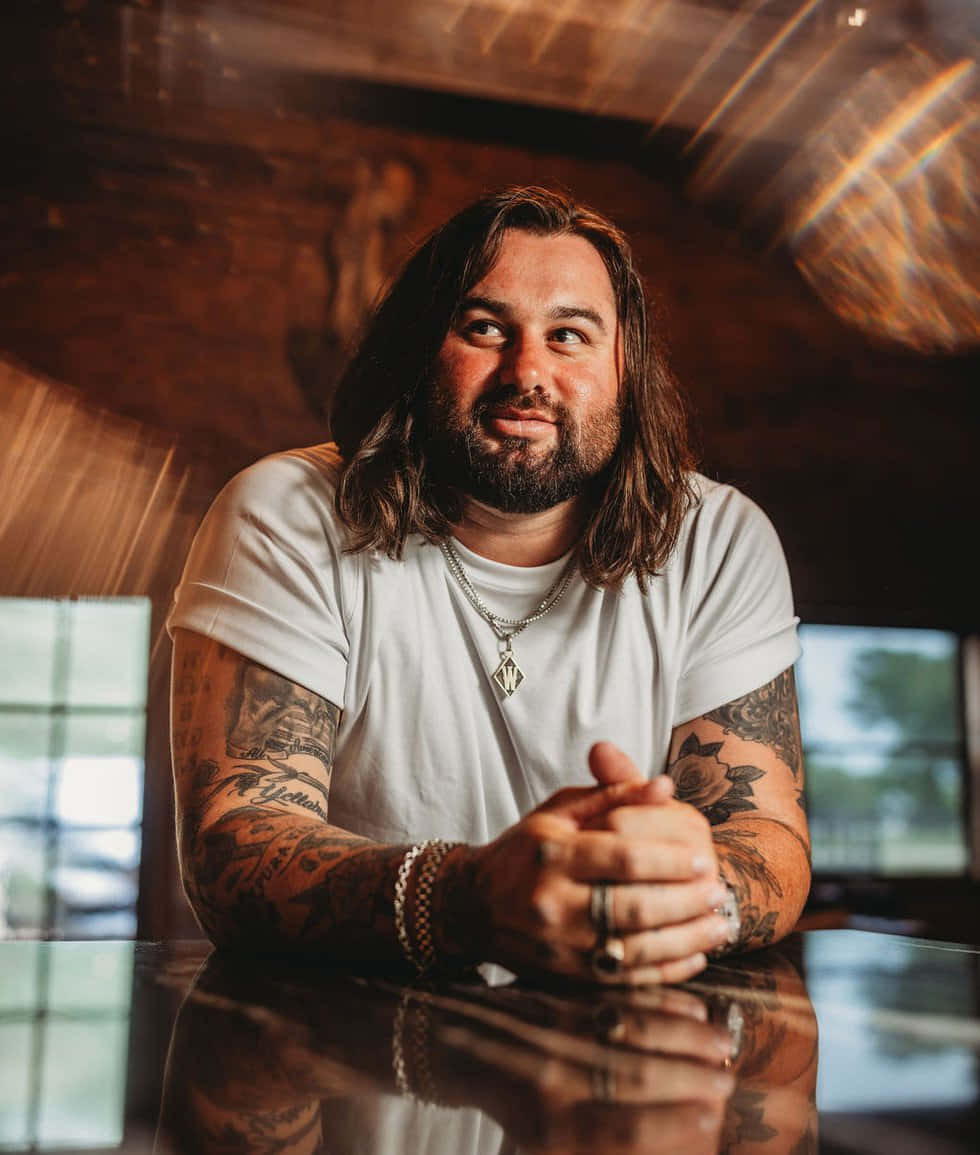 Download Koe Wetzel Smiling Tattooed Musician Wallpaper | Wallpapers.com