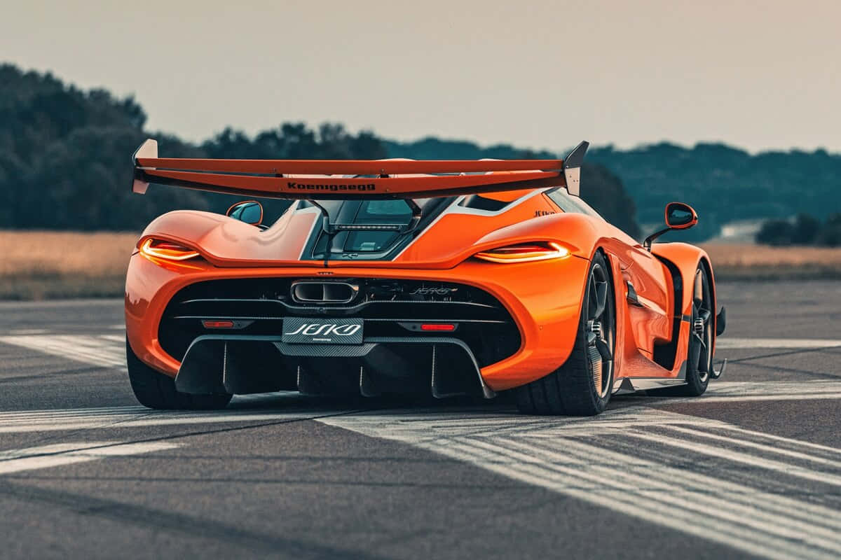 Download Koenigsegg Jesko Orange Rear View Wallpaper | Wallpapers.com