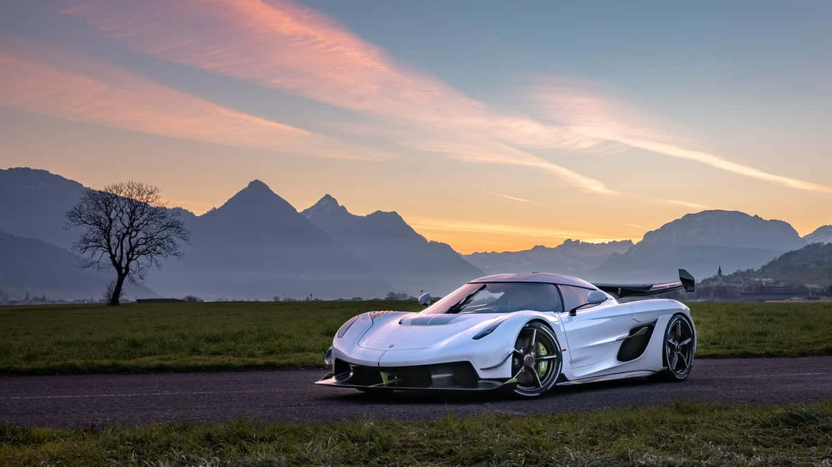 Koenigsegg Jesko Sunset Mountain Backdrop Wallpaper