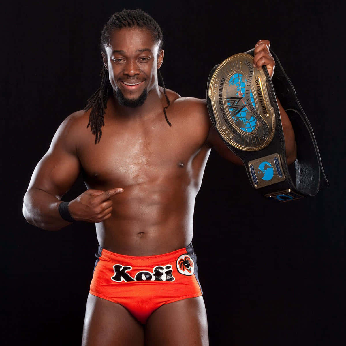 Kofi Kingston Flashing His Wwe Belt Background