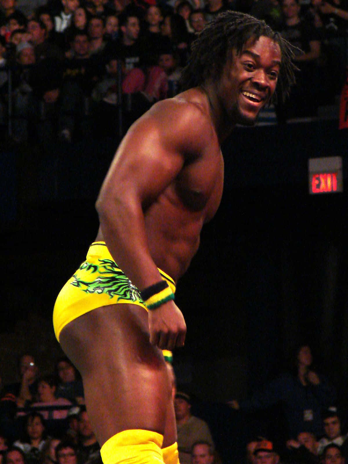 Kofi Kingston Rocking A Bright Yellow Wrestling Brief Wallpaper