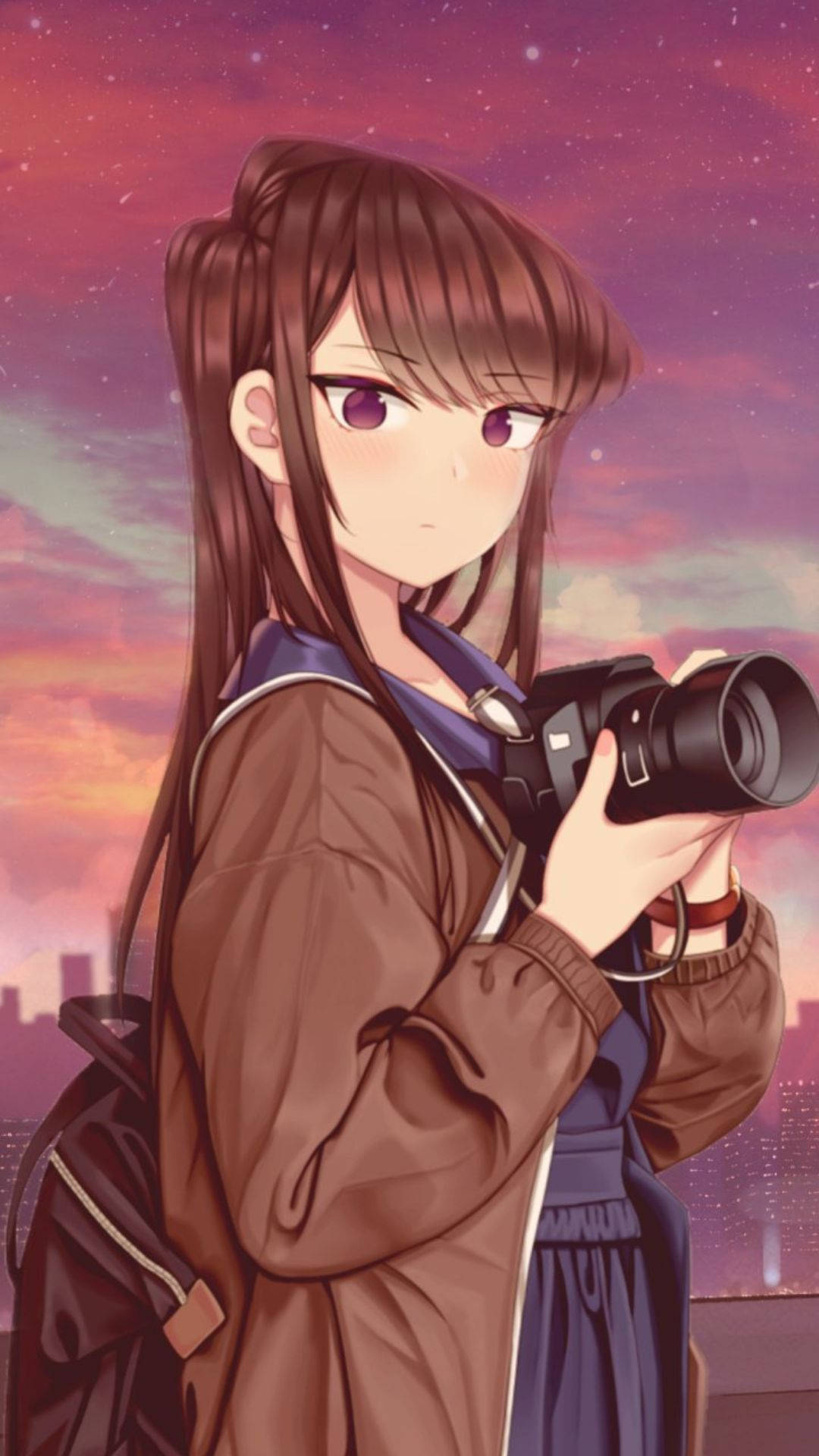 A Girl Holding A Camera In Front Of A Sky Wallpaper