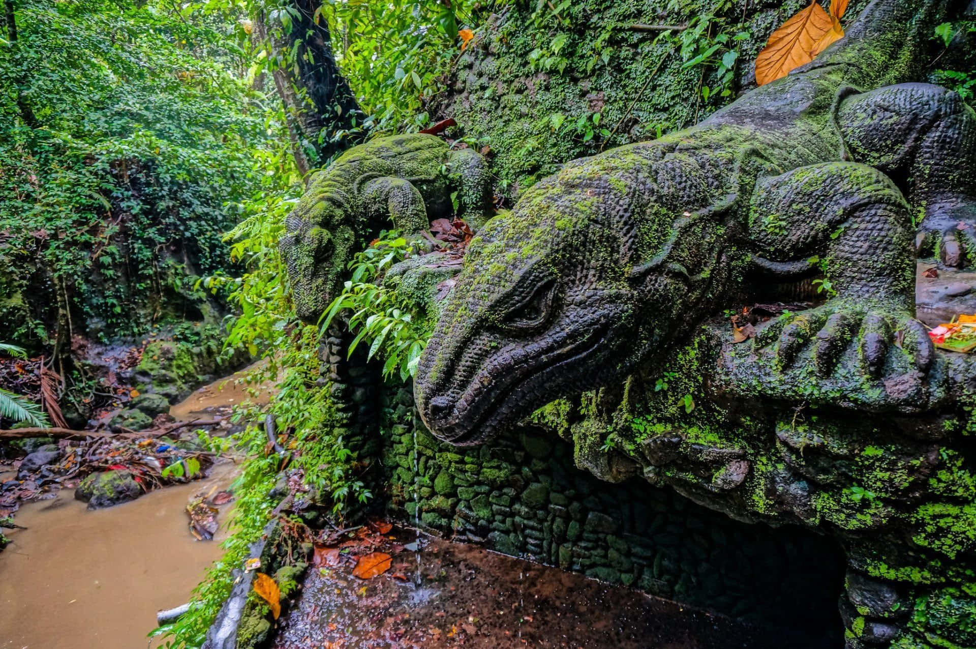 A Statue Of An Iguana In The Jungle