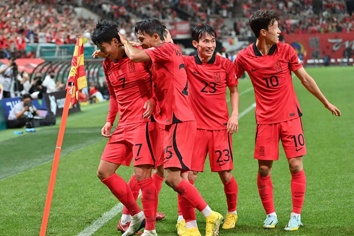 Korea Republic National Football Team showing off their skills and unity on the field Wallpaper
