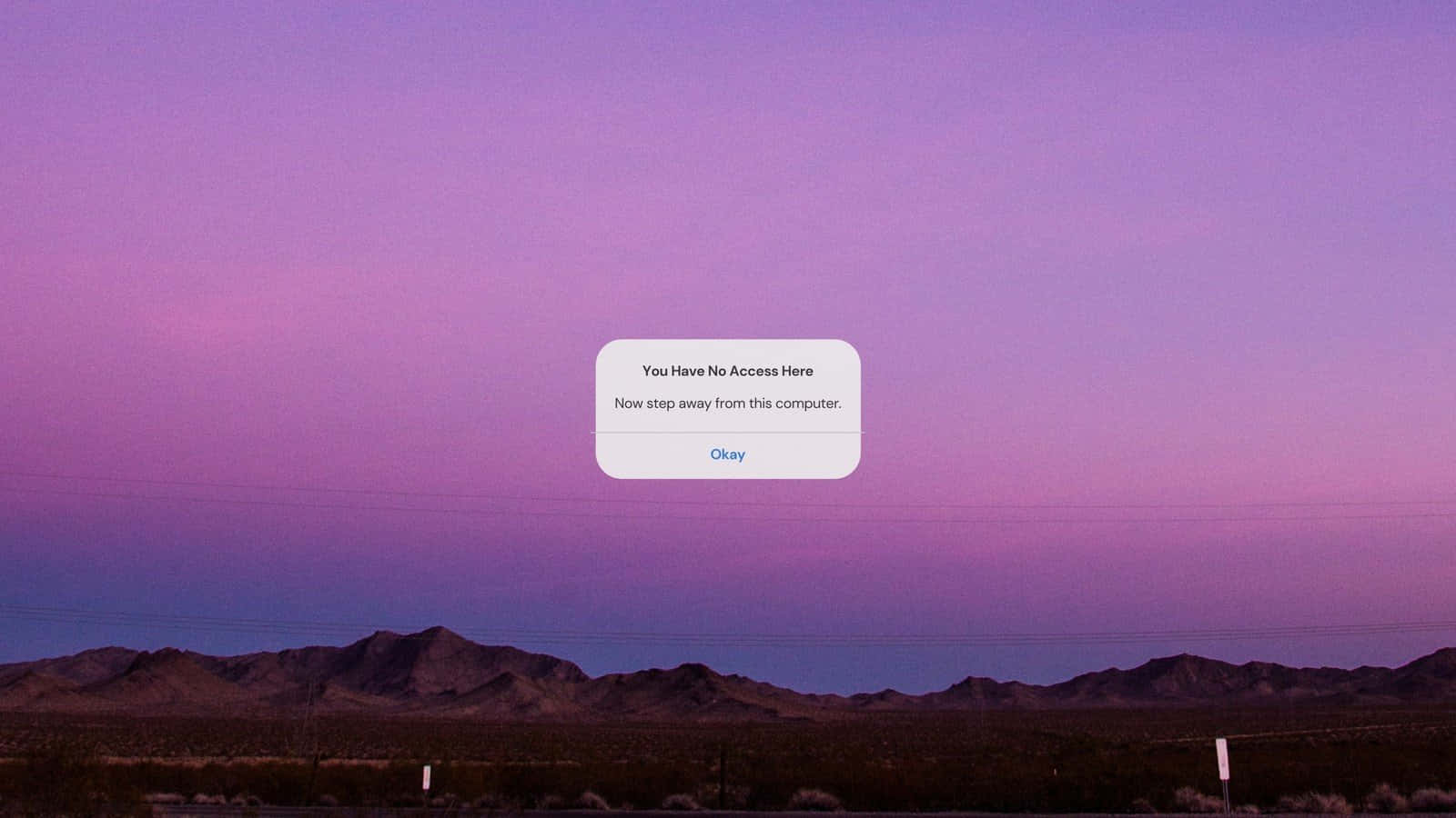 A Purple Sky With Mountains In The Background Wallpaper
