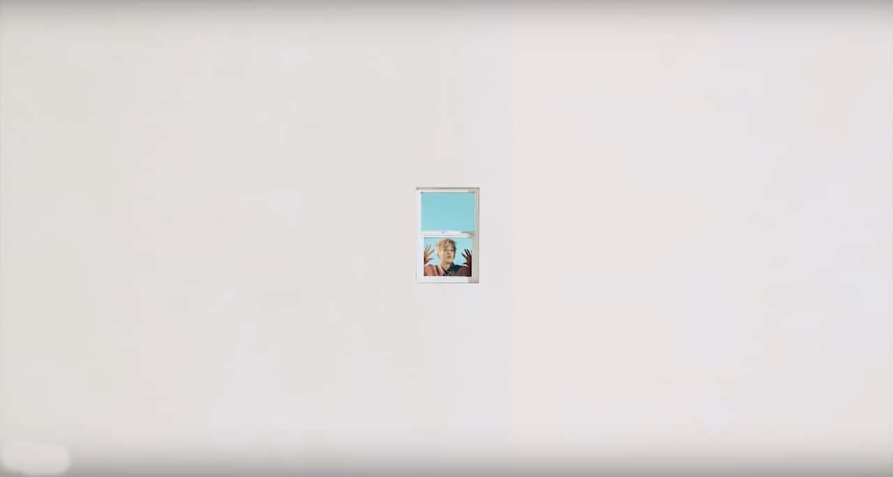 A White Wall With A Picture Of A Woman In A Window Wallpaper