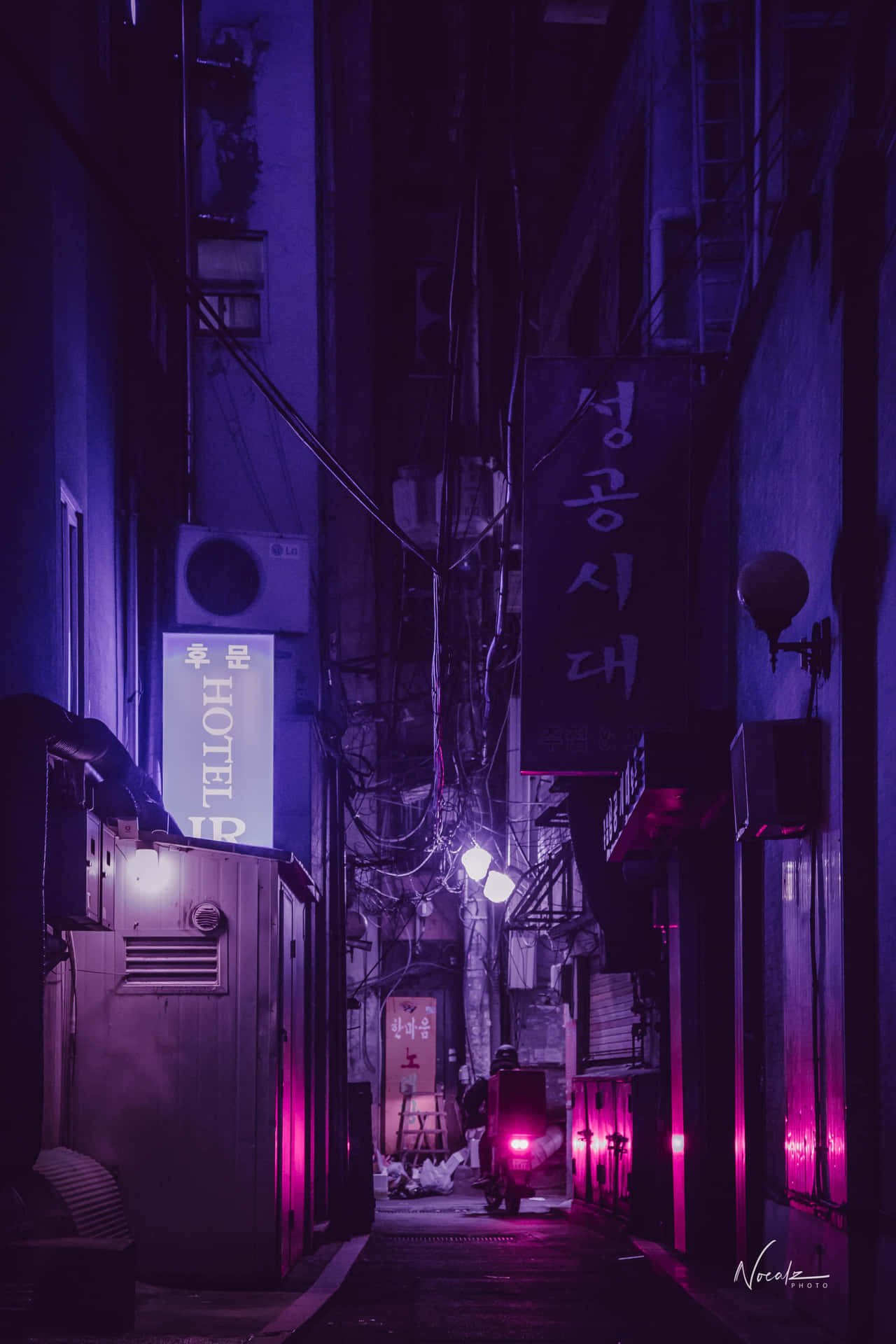 A Street With Neon Lights And A Bike Wallpaper