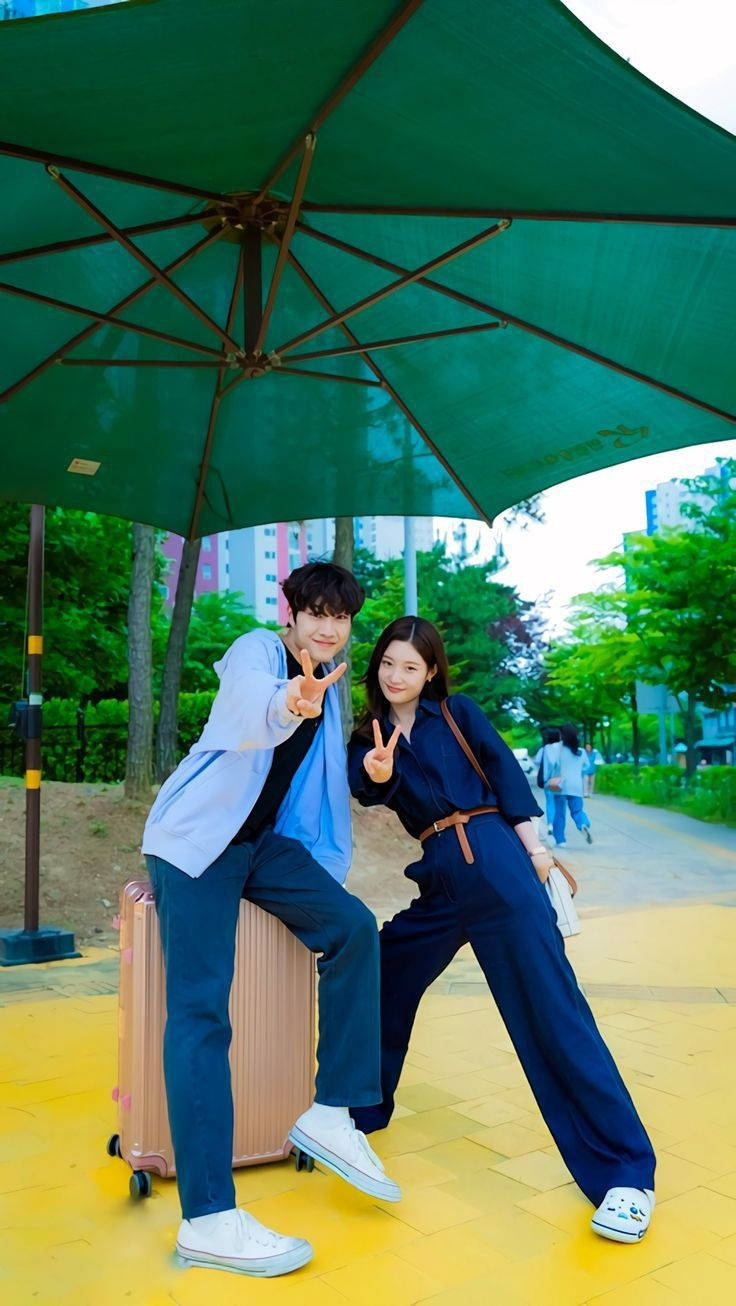 Korean Couple Doing Peace Sign Wallpaper