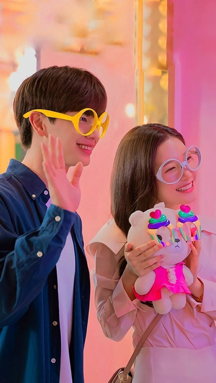 Korean Couple Wearing Colored Eyeglasses Wallpaper