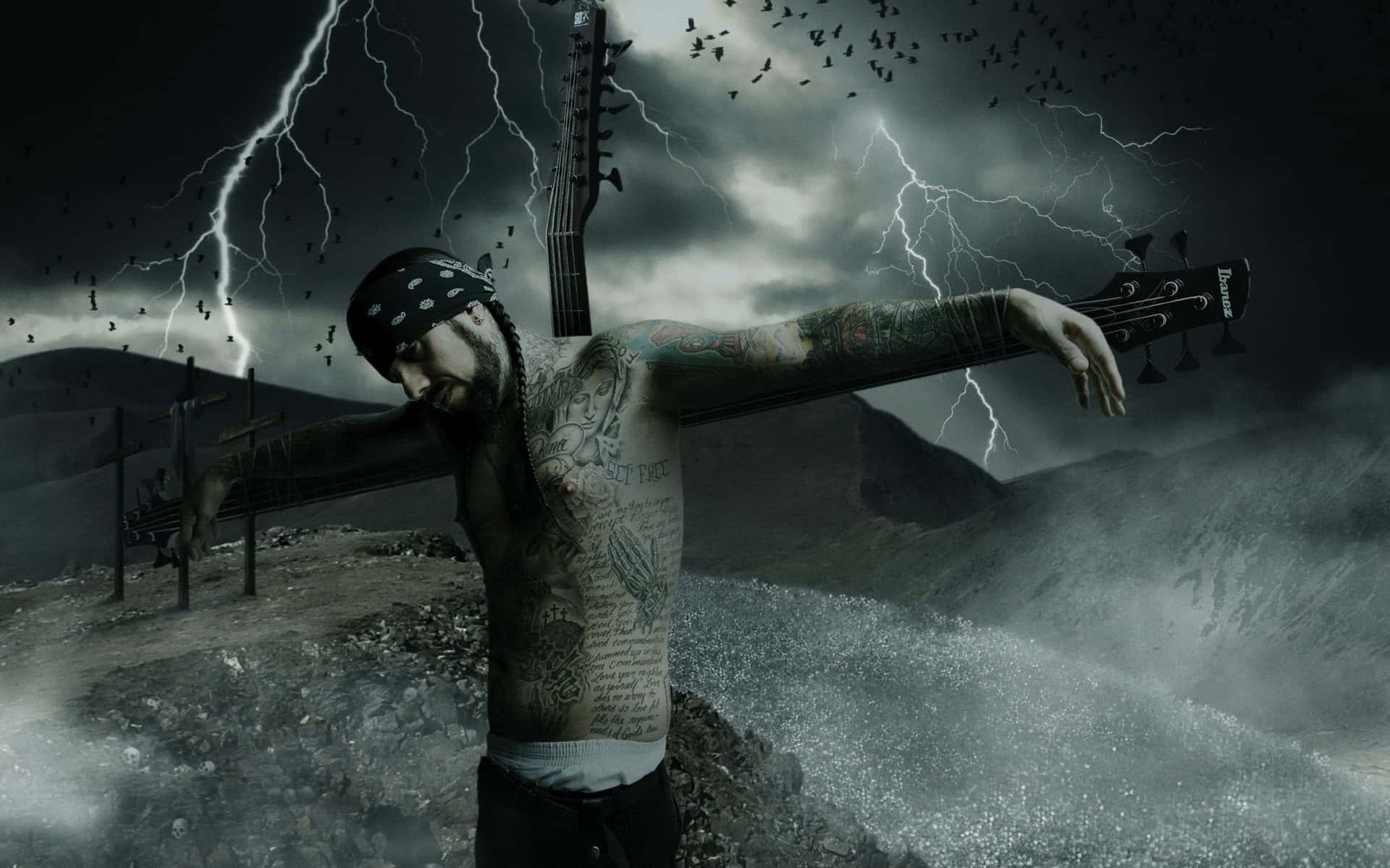 A Man With Tattoos Standing On A Cross With Lightning Wallpaper