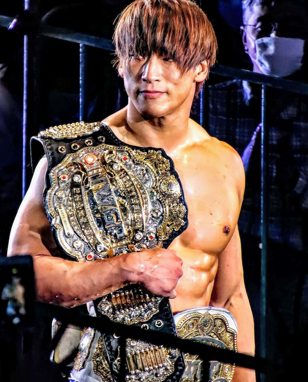 Caption: Kota Ibushi Holding IWGP Intercontinental Champion Title Wallpaper