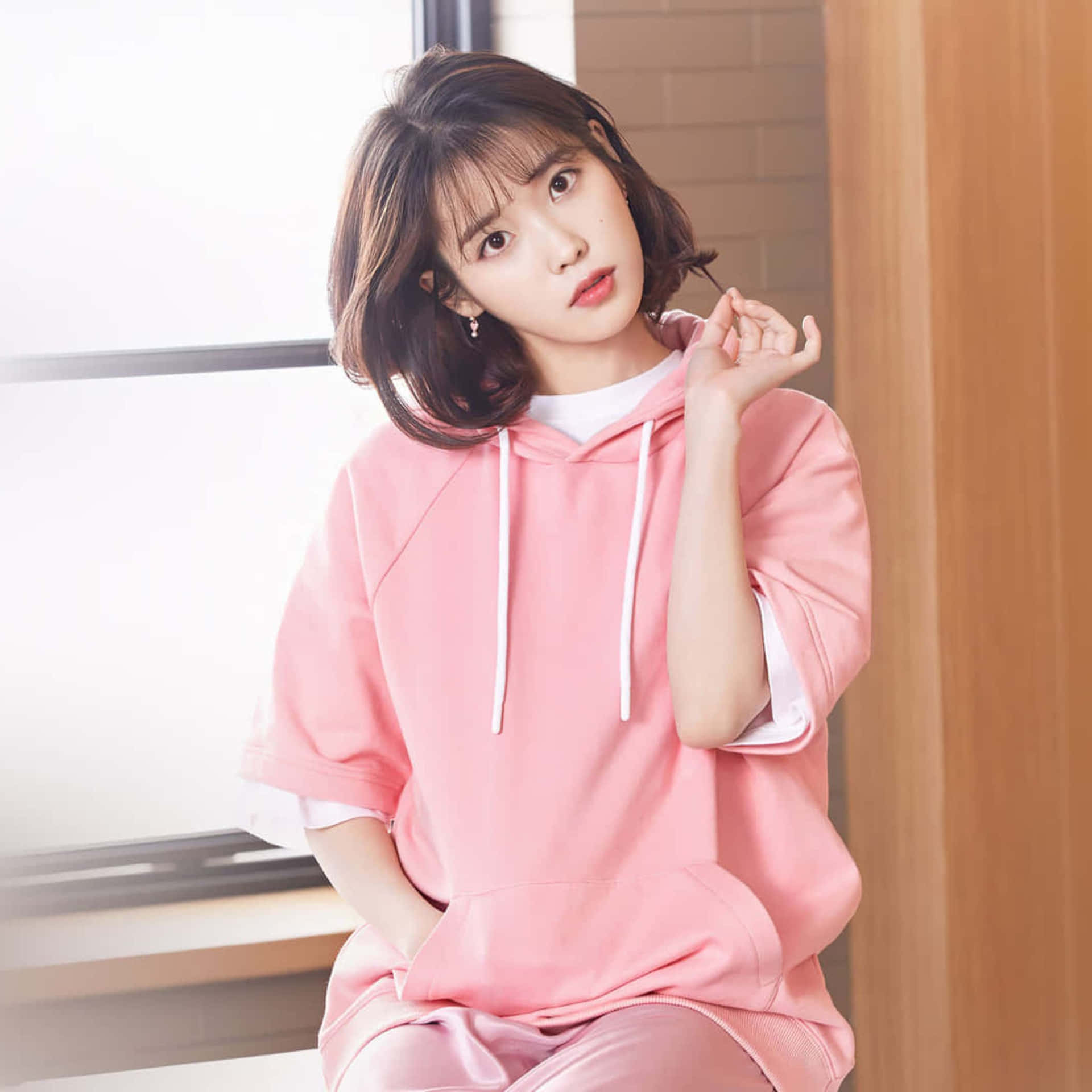 Kpop Star_ Pink Hoodie Pose Wallpaper