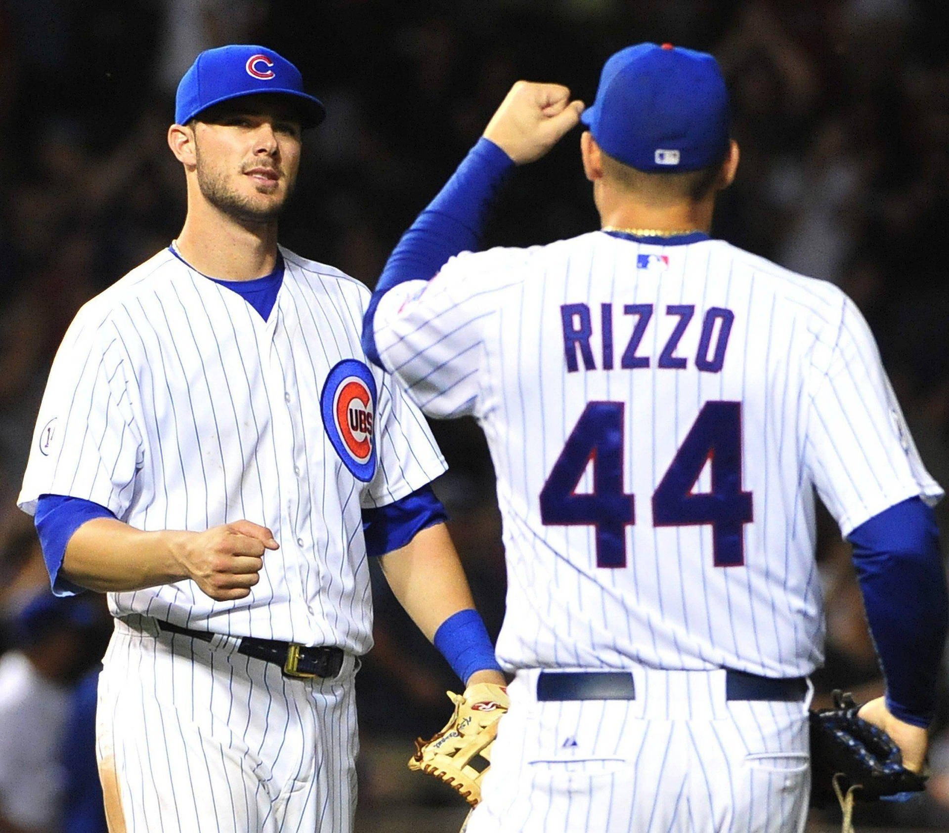Download Kris Bryant Fist Bumping With Rizzo Wallpaper