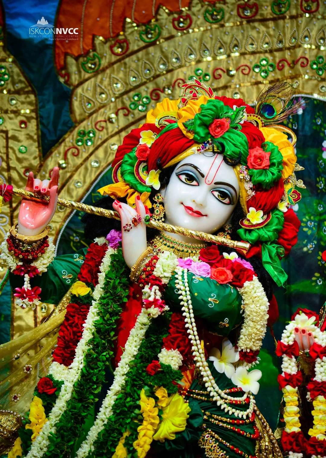 Download Krishna 3d Red Green Flowers Wallpaper | Wallpapers.com