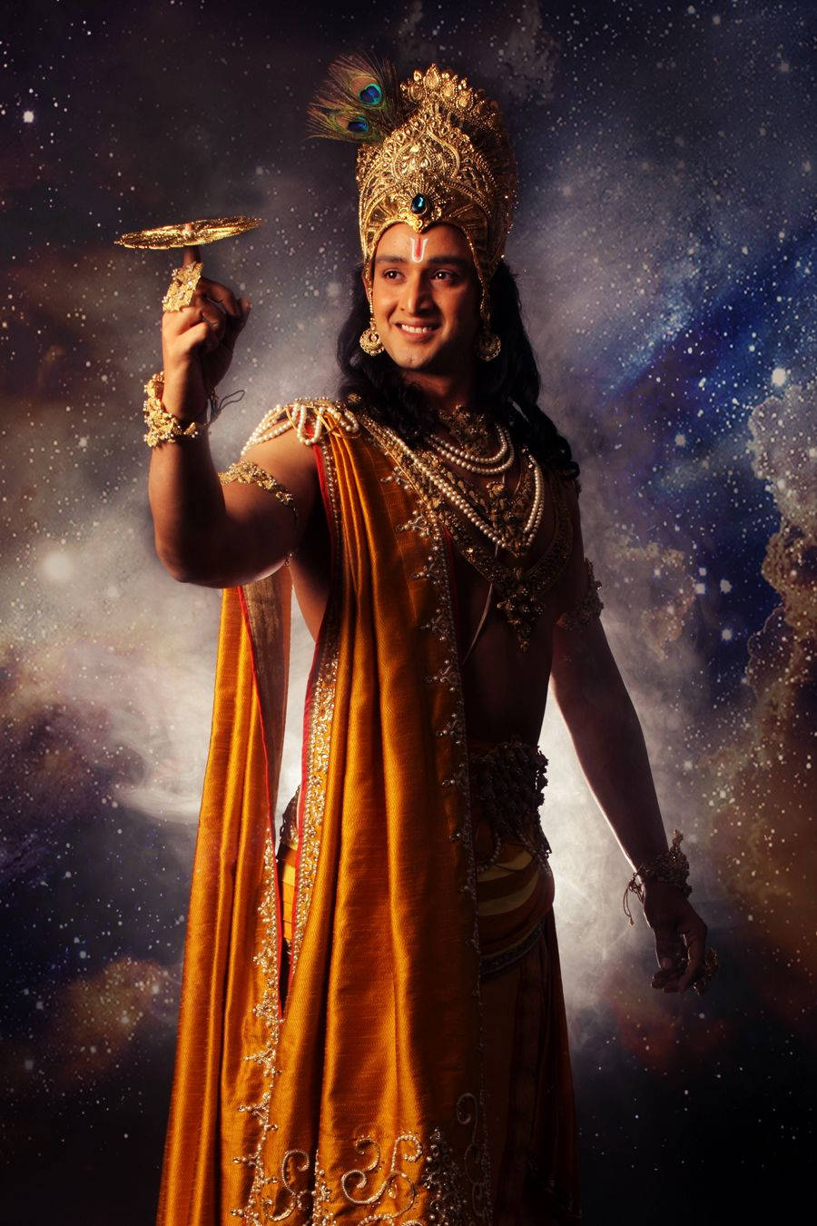 Download Krishna Phone With Gold Trinket Wallpaper | Wallpapers.com