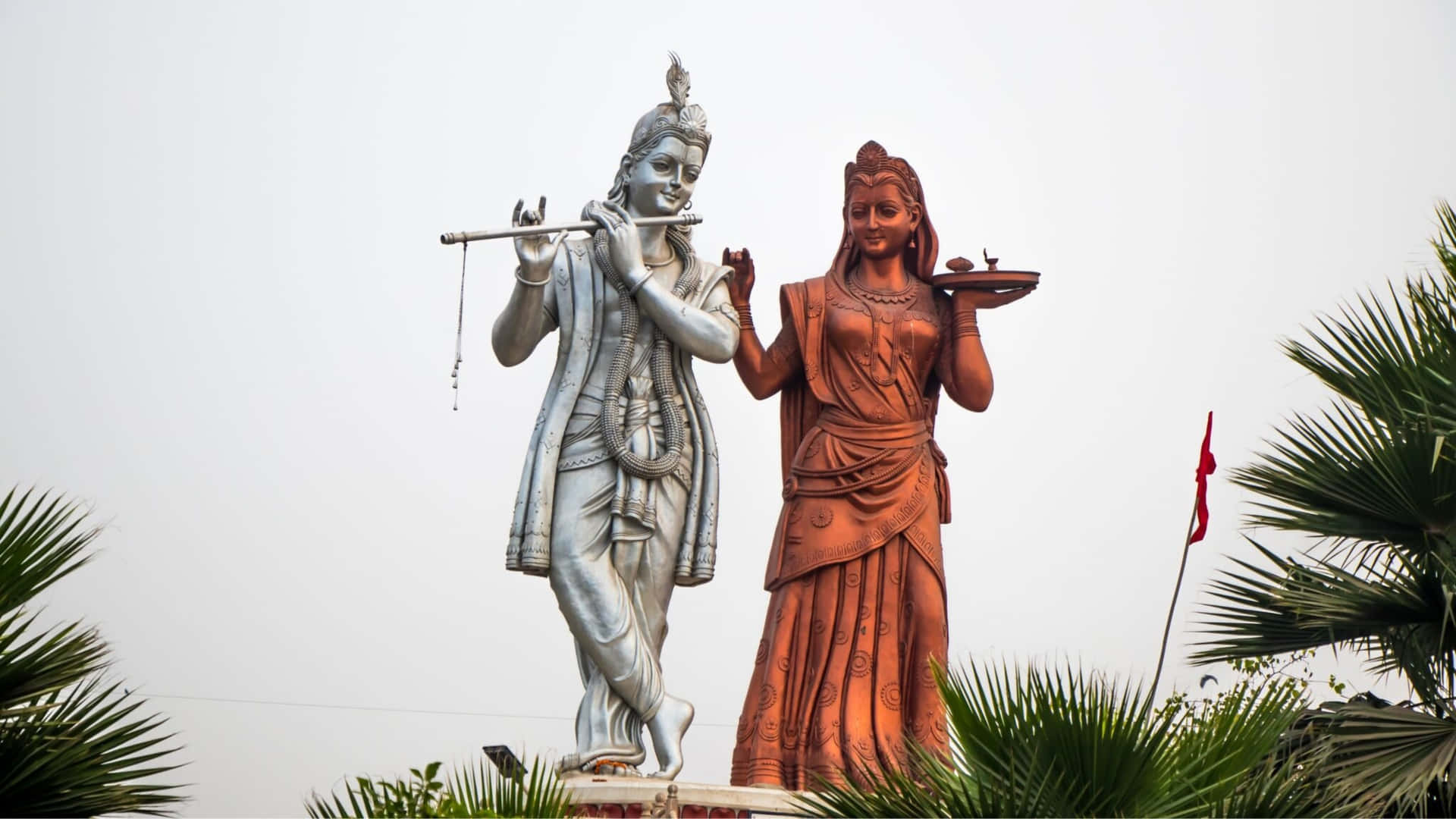 Krishna And Radha Red And White Statues Picture