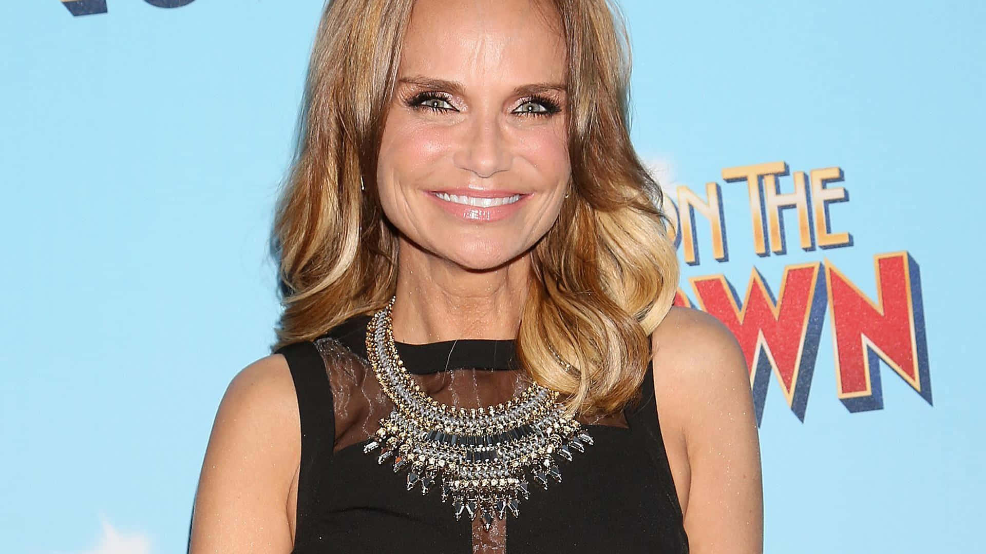 Captivating Kristin Chenoweth Smiling and Sparkling on Red Carpet Wallpaper