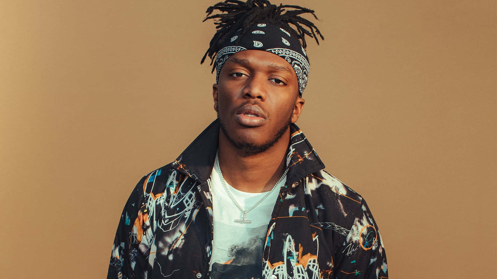 Ksi With Brown Background Wallpaper