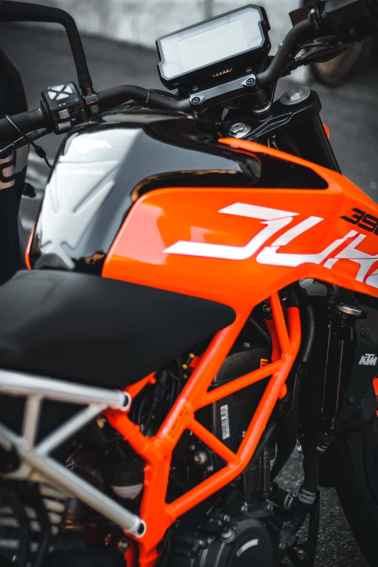 A Motorcycle With An Orange And Black Paint Job