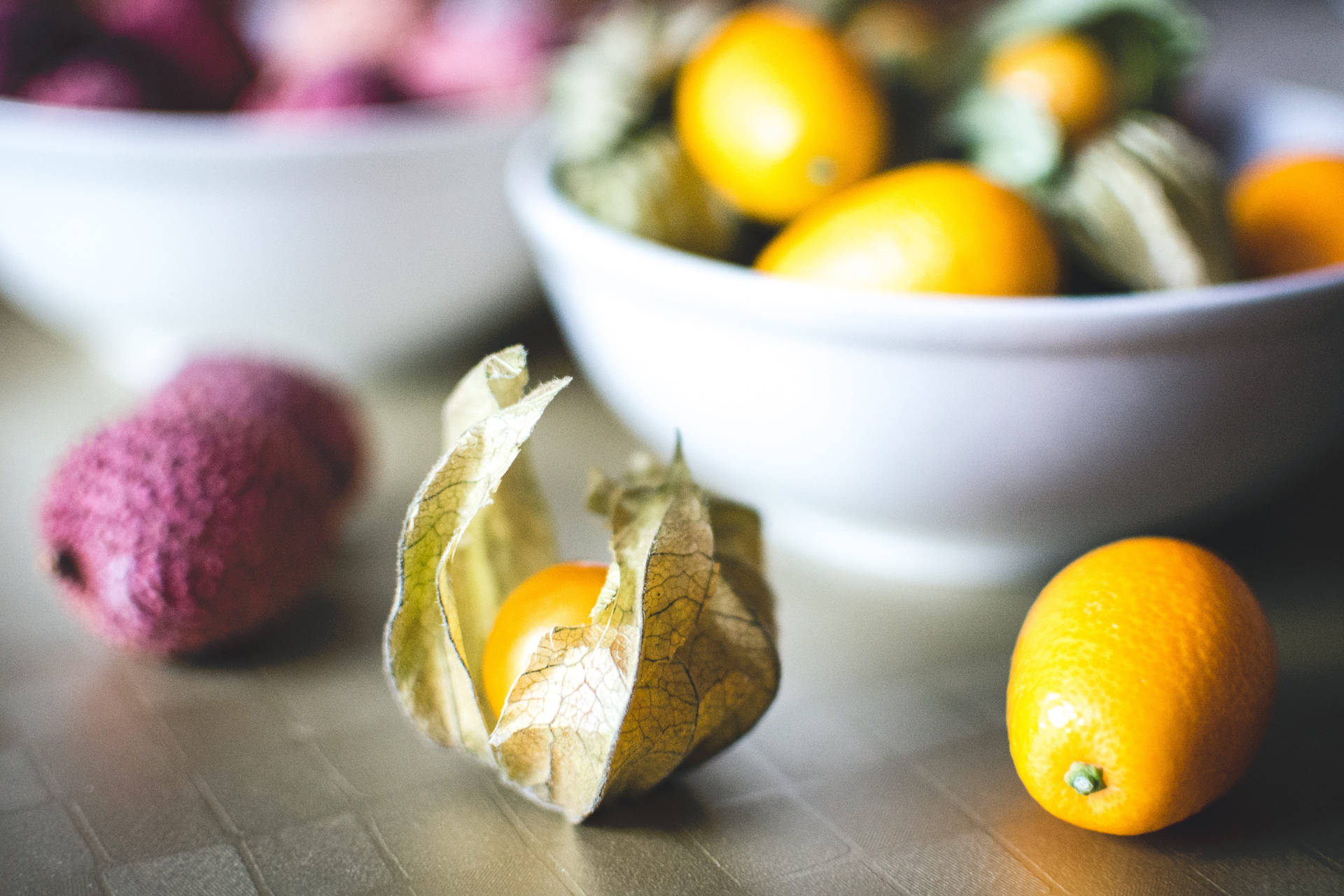 Kumquatoch Litchi-frukter Ögonnivåfotografering. Wallpaper
