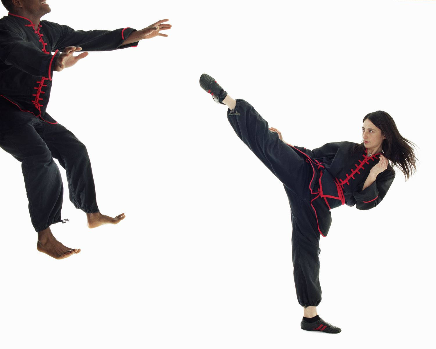 Caption: Mastering the Art of Kung Fu - Gravity-Defying Flying Kick Wallpaper