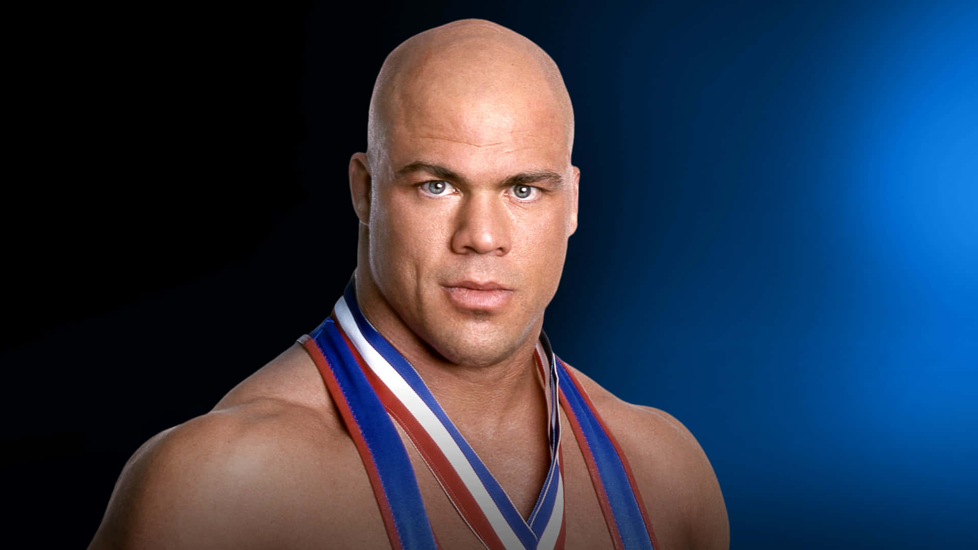 WWE Hall of Famer Kurt Angle Poses in Black and Blue Gradient Background Wallpaper