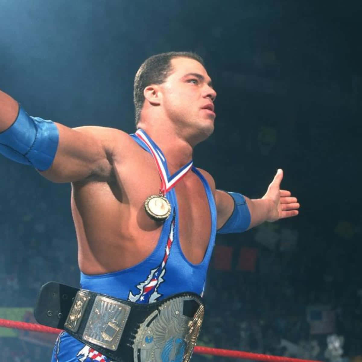 Kurt Angle Poses in Blue Singlet with Championship Belt Wallpaper